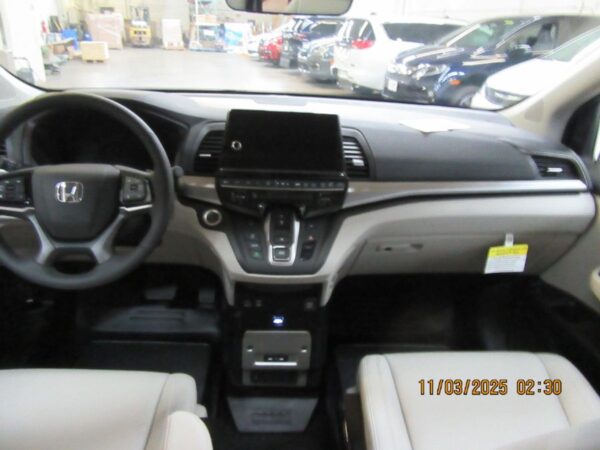 Silver Honda Odyssey with BraunAbility Side Entry Automatic In Floor conversion