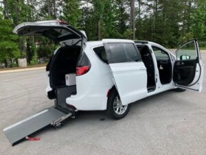 White Chrysler Pacifica with Driverge Rear Entry Manual Fold Out conversion