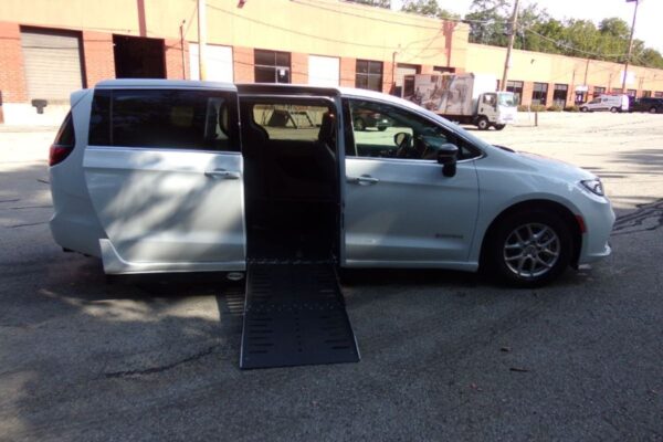 White Chrysler Pacifica with Driverge Side Entry Automatic Fold Out conversion