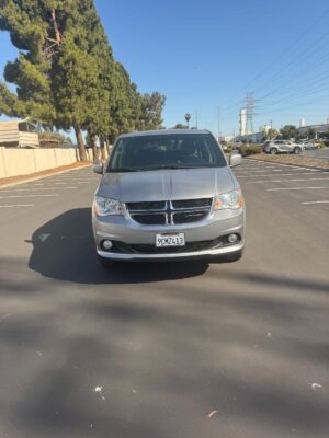 Silver Dodge Grand Caravan with BraunAbility Side Entry Automatic Fold Out conversion