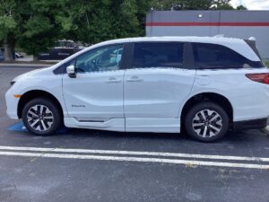 White Honda Odyssey with BraunAbility Side Entry Automatic In Floor conversion