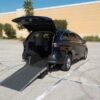 Black Toyota Sienna with Driverge Rear Entry Manual Fold Out conversion