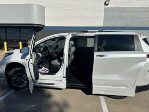 White Toyota Sienna with BraunAbility Side Entry Automatic Fold Out conversion