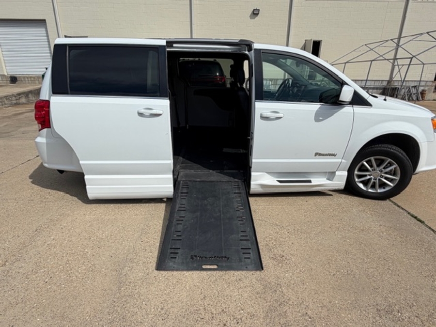 White Dodge Grand Caravan with BraunAbility Side Entry Automatic Fold Out conversion