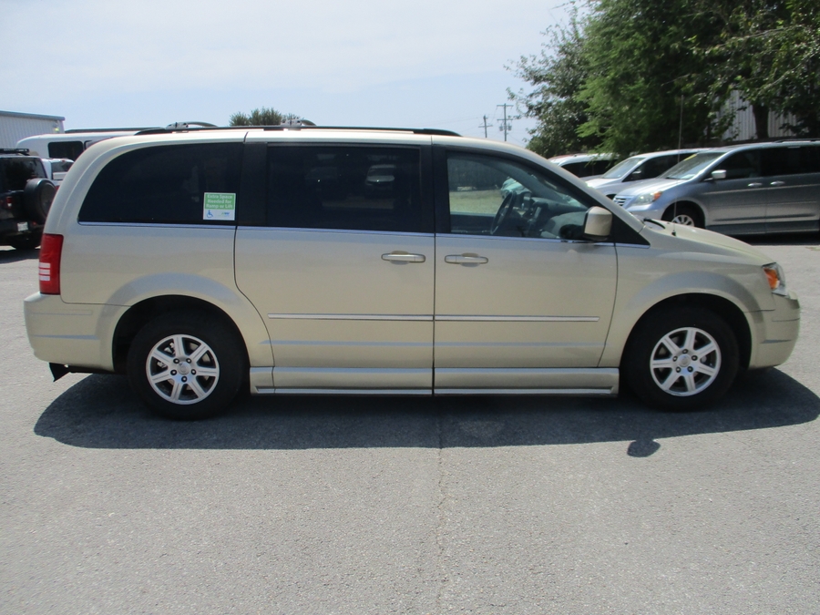 White Chrysler Town and Country with BraunAbility Side Entry Automatic Fold Out conversion