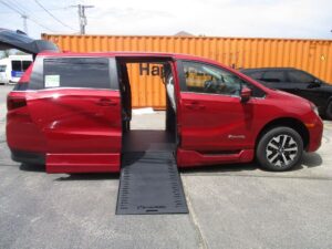 Red Honda Odyssey with BraunAbility Side Entry Automatic In Floor conversion