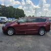 Red Chrysler Voyager with BraunAbility Side Entry Automatic In Floor conversion