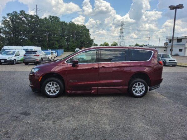 Red Chrysler Voyager with BraunAbility Side Entry Automatic In Floor conversion