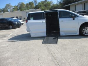 White Chrysler Pacifica with BraunAbility Side Entry Automatic Fold Out conversion