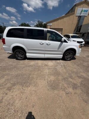 White Dodge Grand Caravan with Adaptive Vans Side Entry Automatic Fold Out conversion