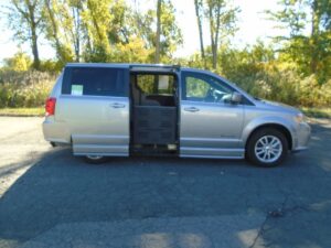 Silver Dodge Grand Caravan with BraunAbility Side Entry Automatic Fold Out conversion