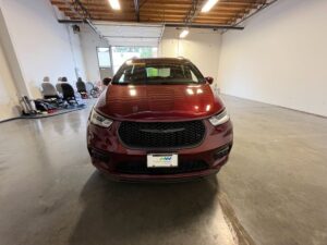 Red Chrysler Pacifica with BraunAbility Side Entry Automatic In Floor conversion