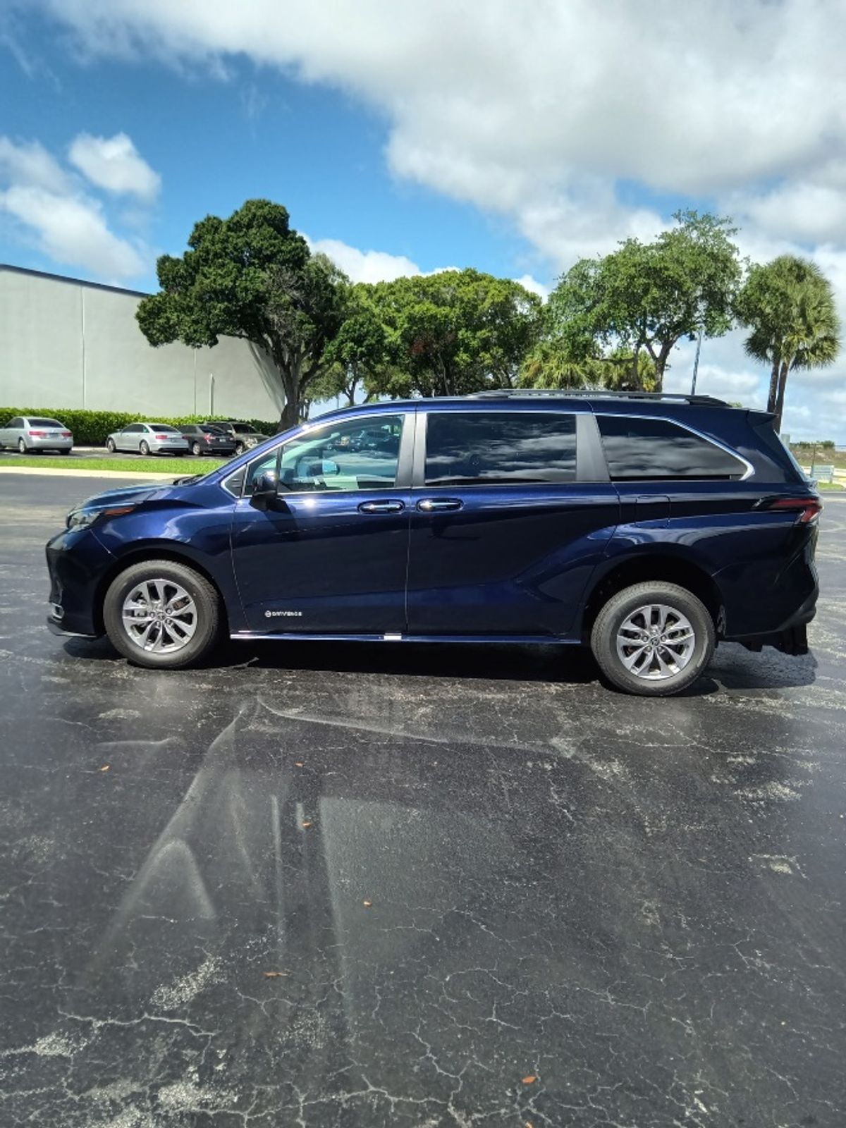 Blue Toyota Sienna with Driverge Rear Entry Manual Fold Out conversion