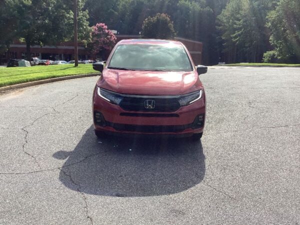 Red Honda Odyssey with BraunAbility Side Entry Automatic In Floor conversion
