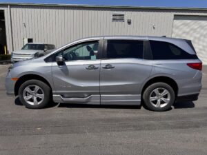 Silver Honda Odyssey with BraunAbility Side Entry Automatic In Floor conversion