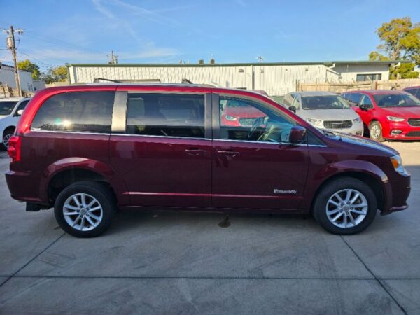 Red Dodge Grand Caravan with BraunAbility Rear Entry Manual Fold Out conversion