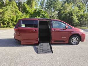 Red Toyota Sienna with BraunAbility Side Entry Automatic Fold Out conversion