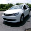 White Chrysler Voyager with BraunAbility Rear Entry Manual Fold Out conversion