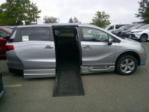 Silver Honda Odyssey with BraunAbility Side Entry Automatic In Floor conversion