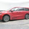 Red Honda Odyssey with BraunAbility Side Entry Automatic In Floor conversion