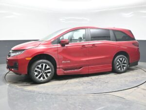 Red Honda Odyssey with BraunAbility Side Entry Automatic In Floor conversion