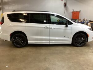 White Chrysler Pacifica with BraunAbility Side Entry Automatic Fold Out conversion