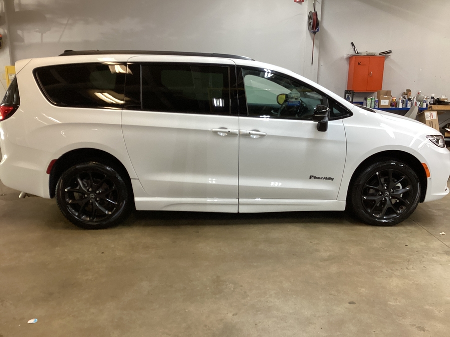 White Chrysler Pacifica with BraunAbility Side Entry Automatic Fold Out conversion
