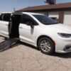 White Chrysler Pacifica with Driverge Side Entry Automatic Fold Out conversion