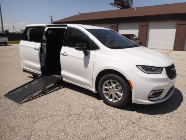 White Chrysler Pacifica with Driverge Side Entry Automatic Fold Out conversion