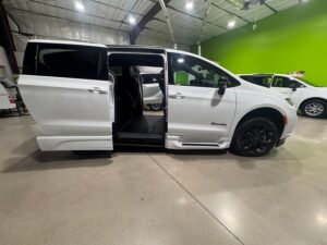 White Chrysler Pacifica with BraunAbility Side Entry Automatic In Floor conversion