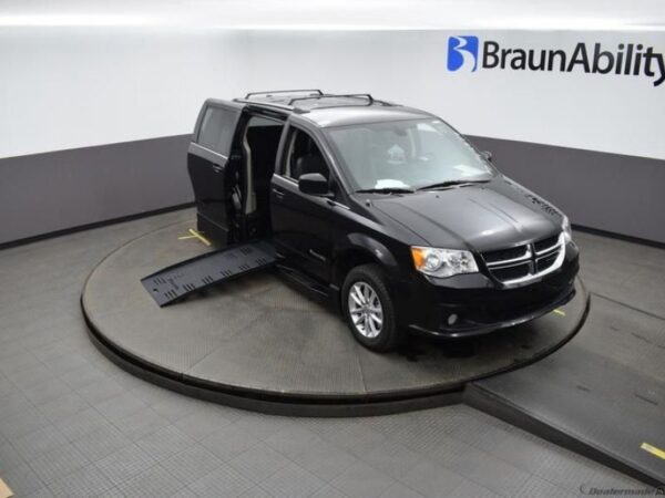 Black Dodge Grand Caravan with BraunAbility Side Entry Automatic Fold Out conversion