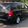 Black Dodge Grand Caravan with Driverge Side Entry Automatic Fold Out conversion