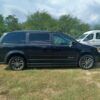 Black Dodge Grand Caravan with BraunAbility Side Entry Automatic Fold Out conversion