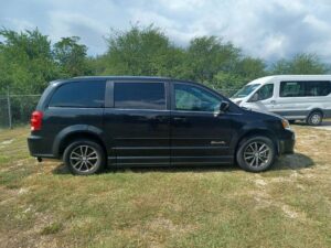Black Dodge Grand Caravan with BraunAbility Side Entry Automatic Fold Out conversion