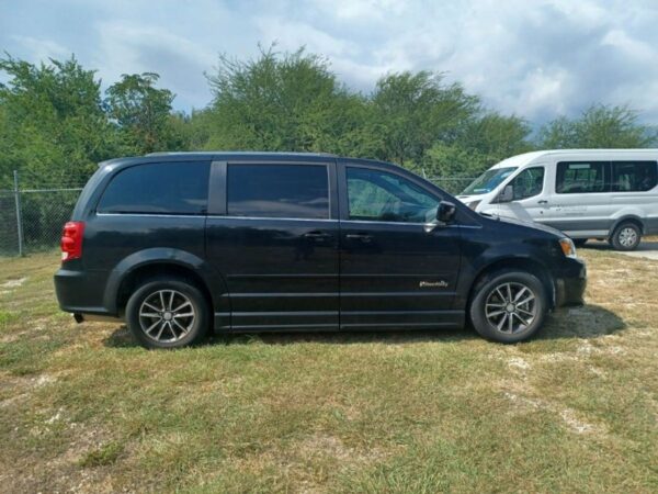 Black Dodge Grand Caravan with BraunAbility Side Entry Automatic Fold Out conversion