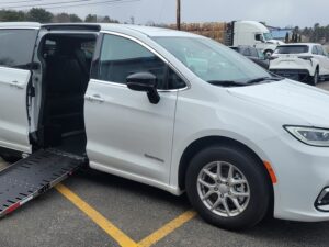 White Chrysler Pacifica with Driverge Side Entry Automatic Fold Out conversion
