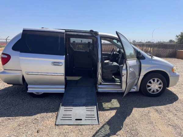 Silver Chrysler Town and Country with BraunAbility Side Entry Automatic Fold Out conversion