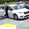 White Chrysler Pacifica with BraunAbility Side Entry Automatic Fold Out conversion