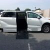 White Toyota Sienna with BraunAbility Side Entry Automatic Fold Out conversion