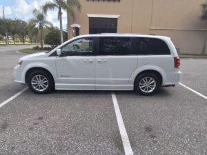 White Dodge Grand Caravan with BraunAbility Side Entry Automatic Fold Out conversion