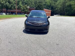 Black Chrysler Voyager with Driverge Side Entry Automatic Fold Out conversion