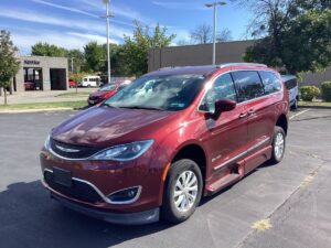Red Chrysler Pacifica with BraunAbility Side Entry Automatic Fold Out conversion