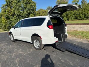 Red Chrysler Voyager with BraunAbility Side Entry Automatic Fold Out conversion
