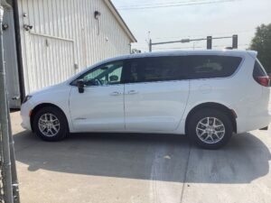 White Chrysler Voyager with Driverge Side Entry Automatic Fold Out conversion