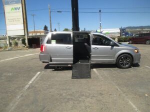 Silver Dodge Grand Caravan with Adaptive Vans Side Entry Automatic Fold Out conversion