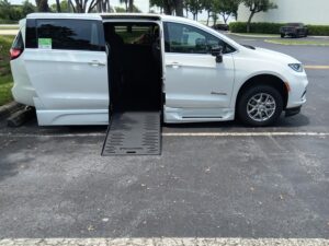 White Chrysler Pacifica with BraunAbility Side Entry Automatic Fold Out conversion