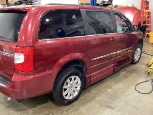 Red Chrysler Town and Country with BraunAbility Side Entry Automatic Fold Out conversion