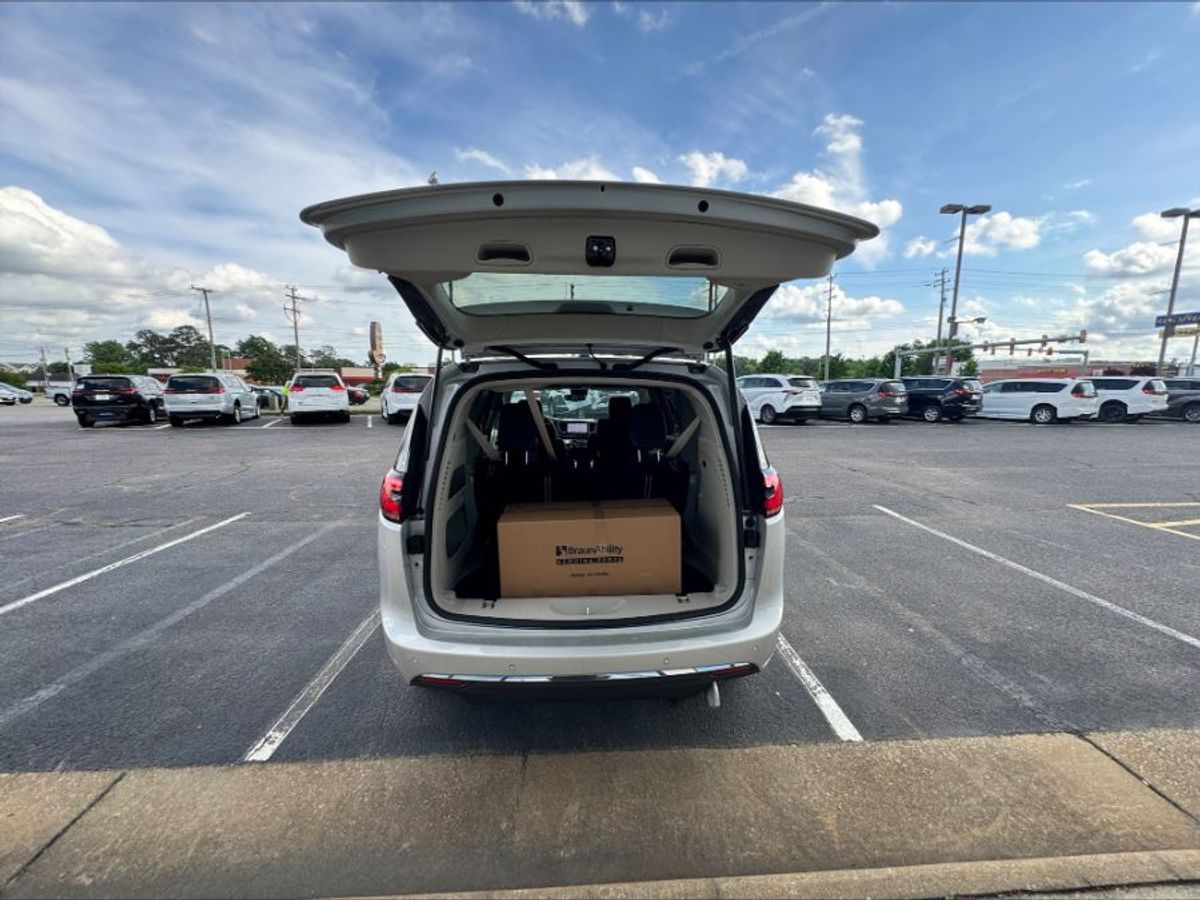 Silver Chrysler Pacifica with BraunAbility Side Entry Automatic Fold Out conversion