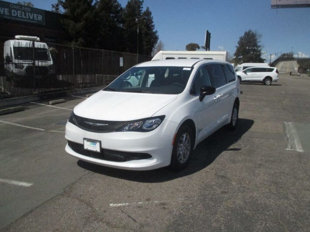 White Chrysler Voyager with Driverge Side Entry Automatic Fold Out conversion