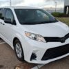 White Toyota Sienna with Driverge Rear Entry Manual Fold Out conversion